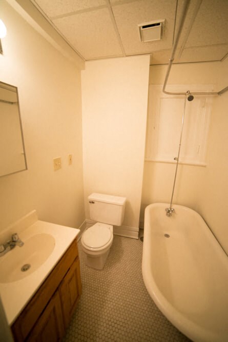a bathroom with a sink toilet and a bath tub