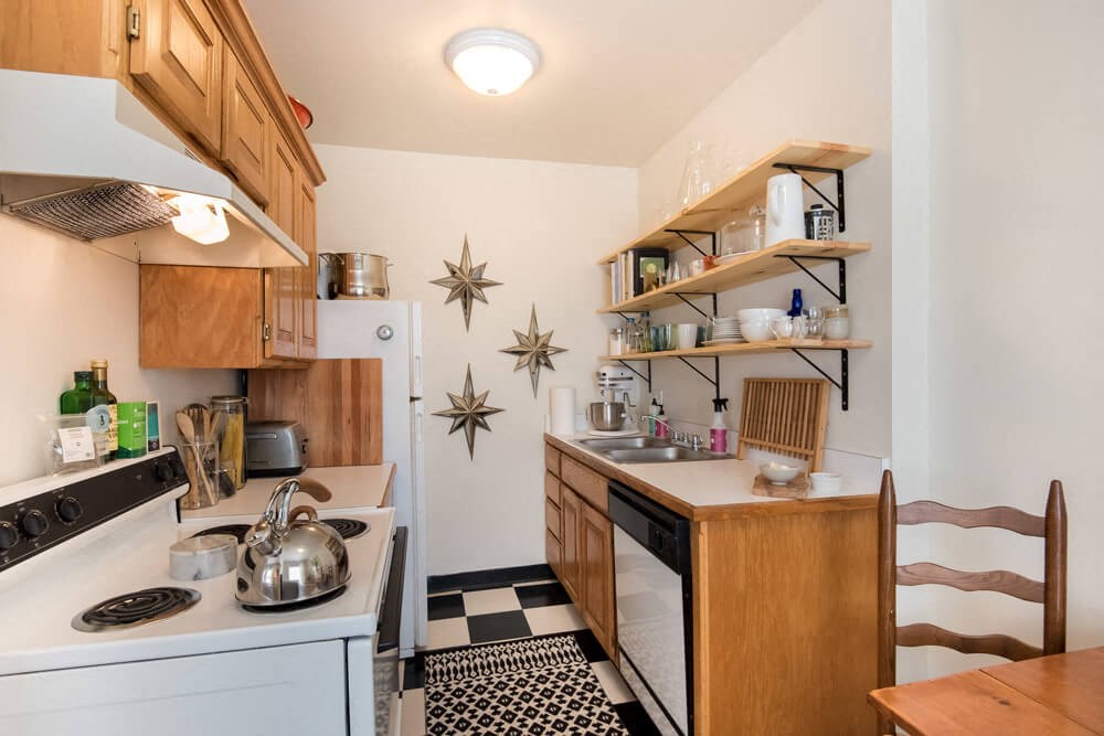 a small kitchen with a stove and a sink