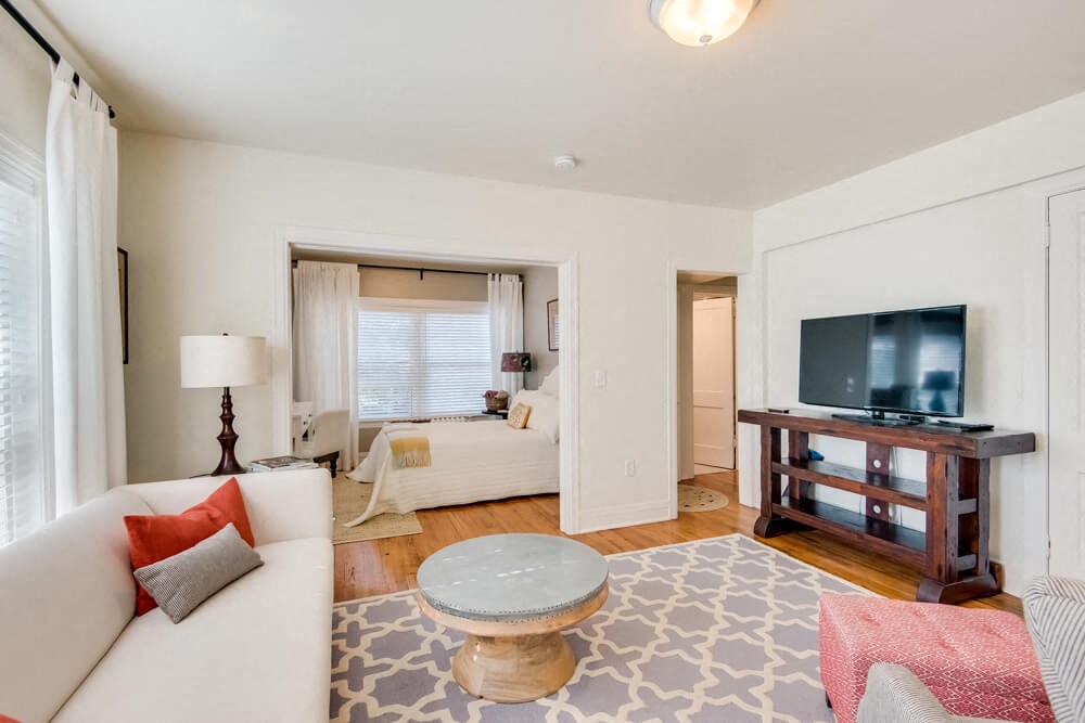 a living room with a couch and a tv