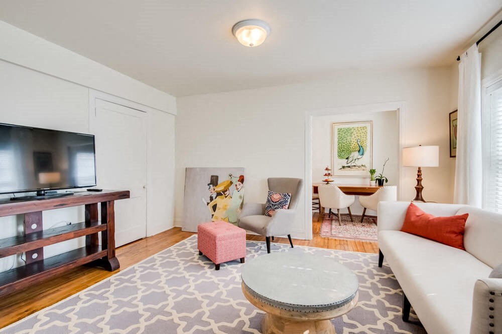 a living room with a couch and a tv