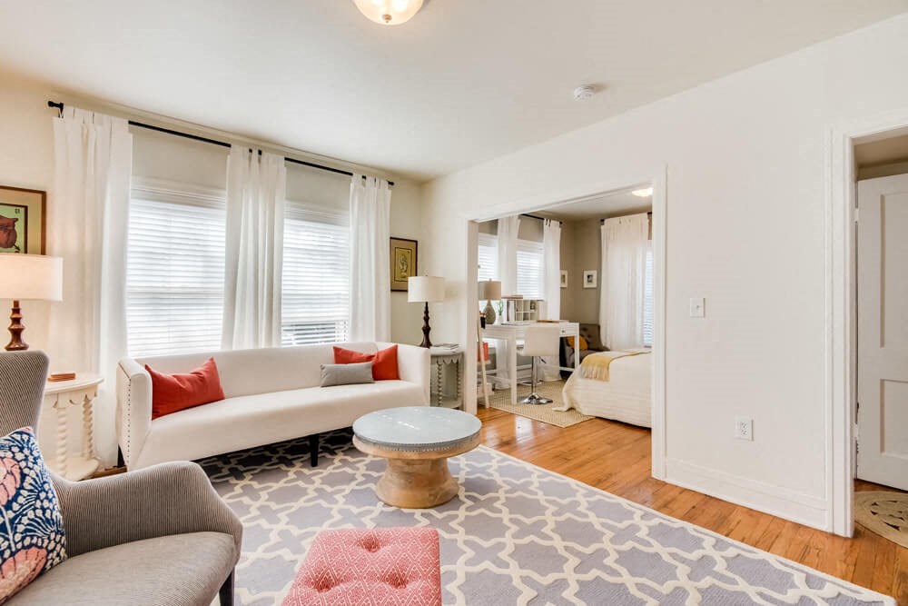 a living room with a couch and a table
