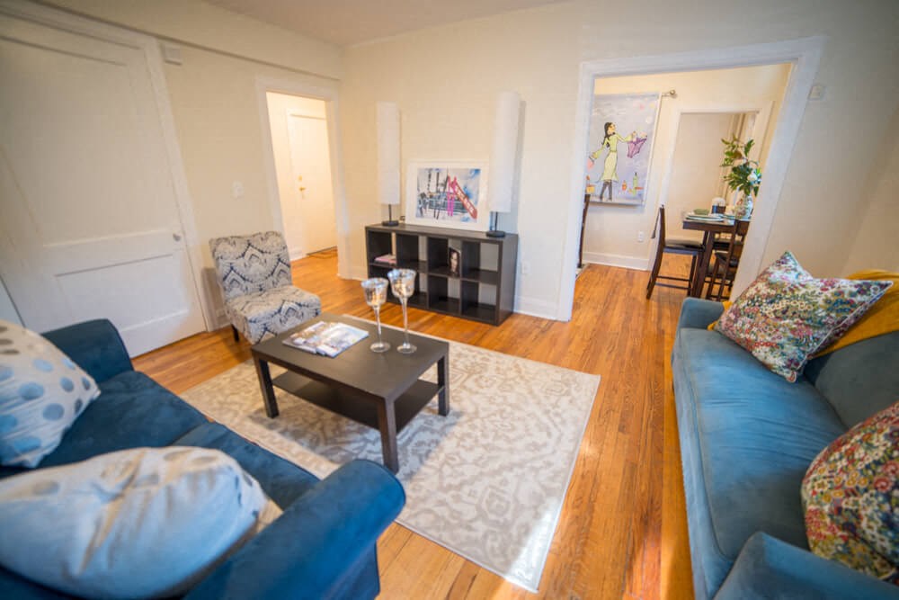 a living room with couches and a coffee table