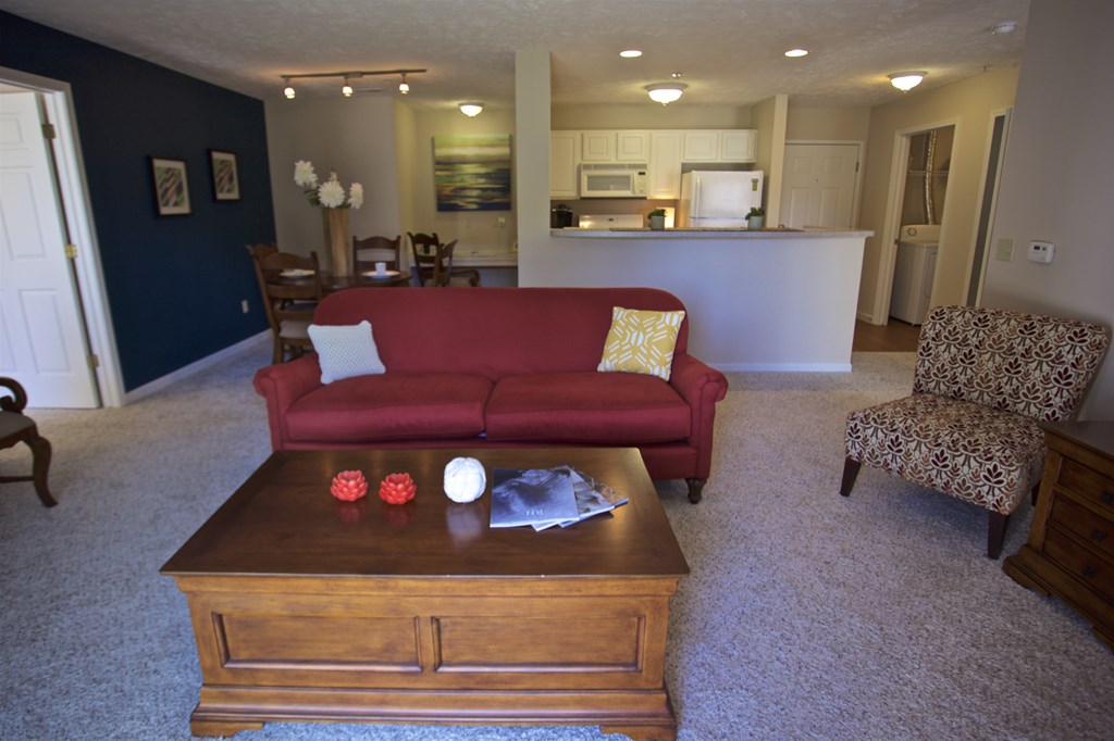 the view of the living room and kitchen from the dining room