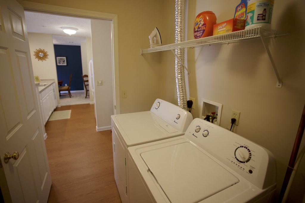 a laundry room with a washer and a dryer in it