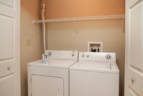 the washer and dryer in the laundry room of a home