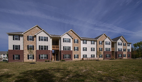 A large apartment complex with multiple buildings and balconies.