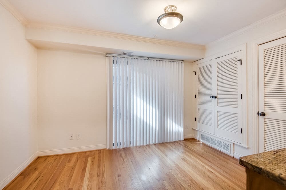 an empty living room with a sliding glass door