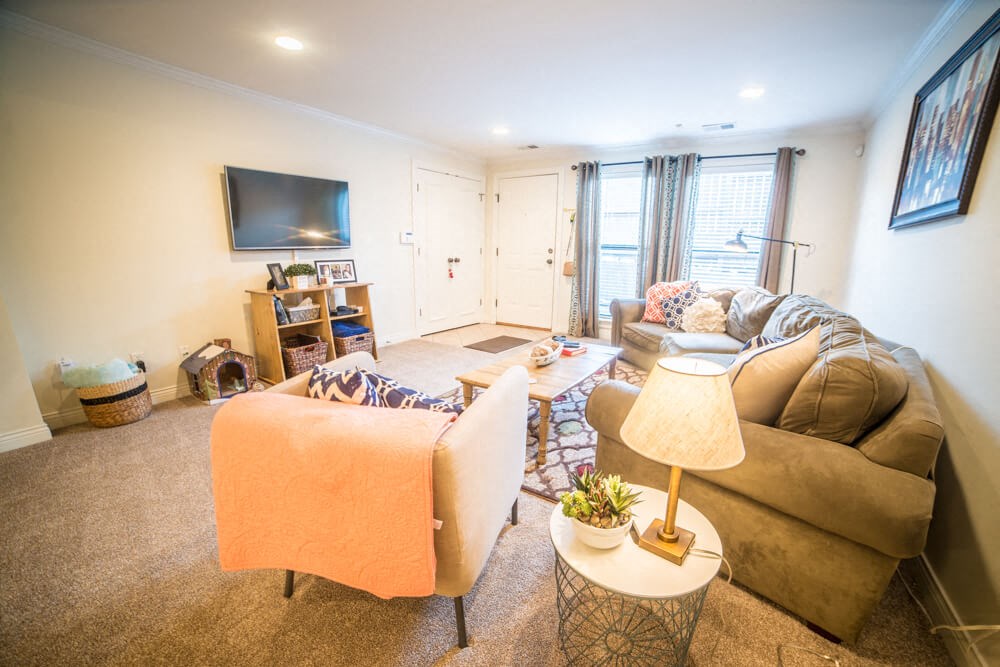 a living room with a couch and a tv