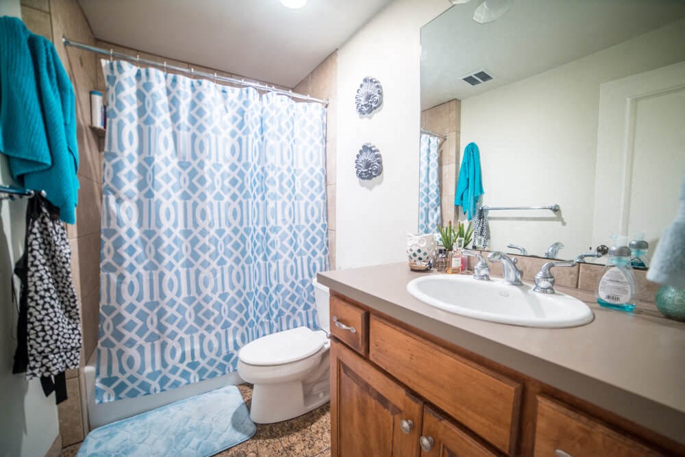 a bathroom with a sink toilet and a shower
