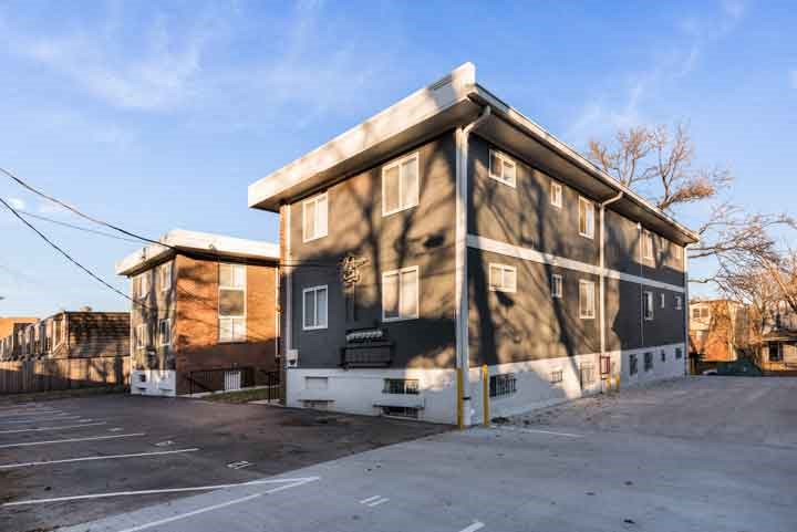 a building that is being remodeled in a parking lot