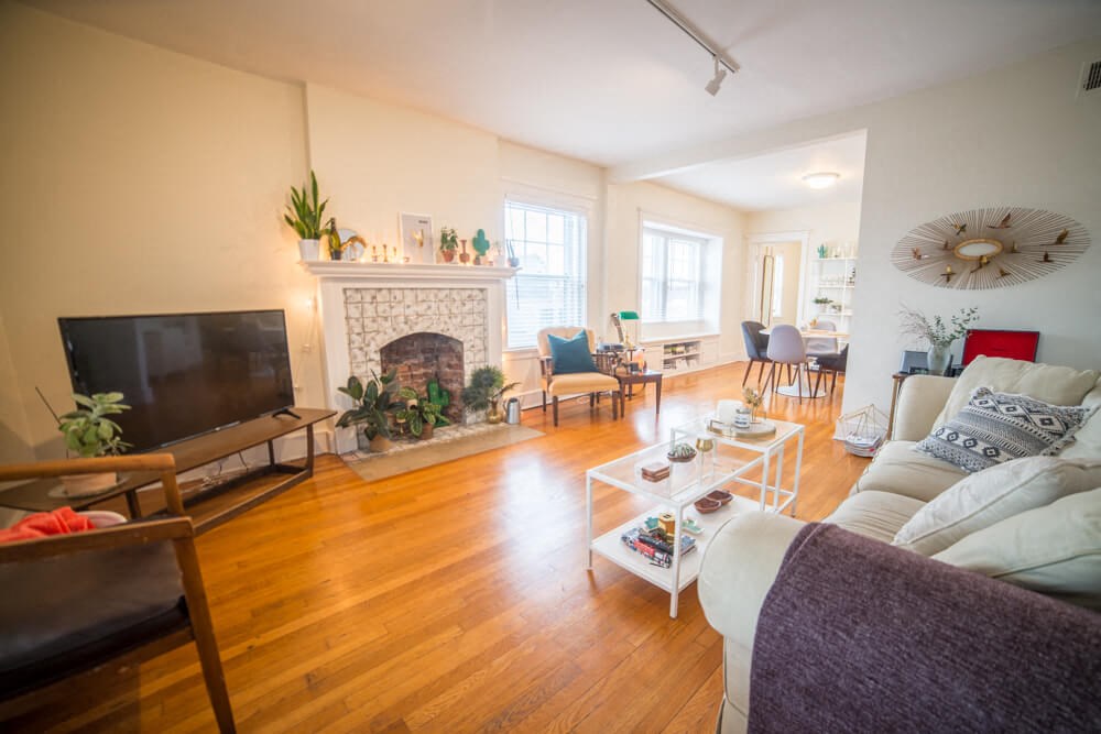 a living room with a couch and a fire place