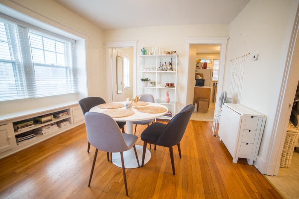 a dining room with a table and chairs