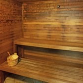 A wooden bench with a bowl and spoon on it.