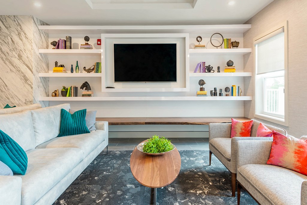 a living room with a couch and a table and a television
