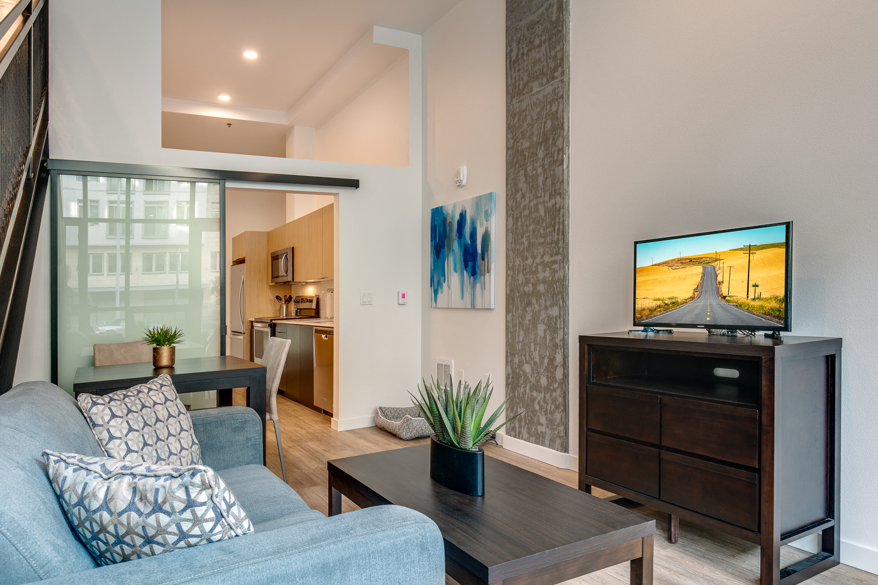 a living room with a couch and a tv