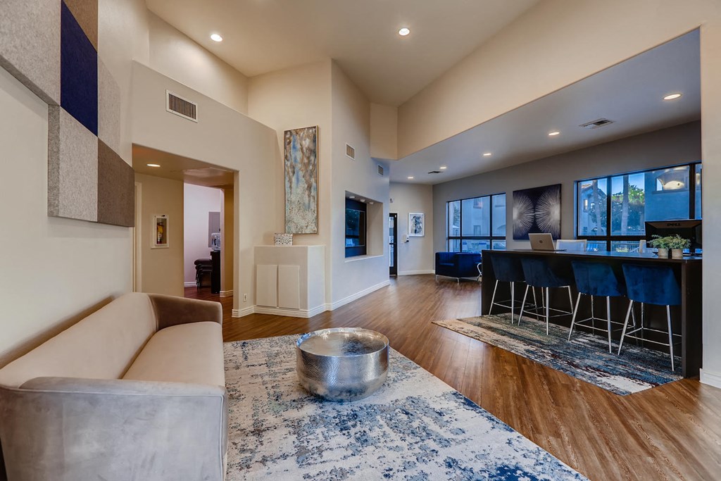 a living room with a couch and a bar in a house