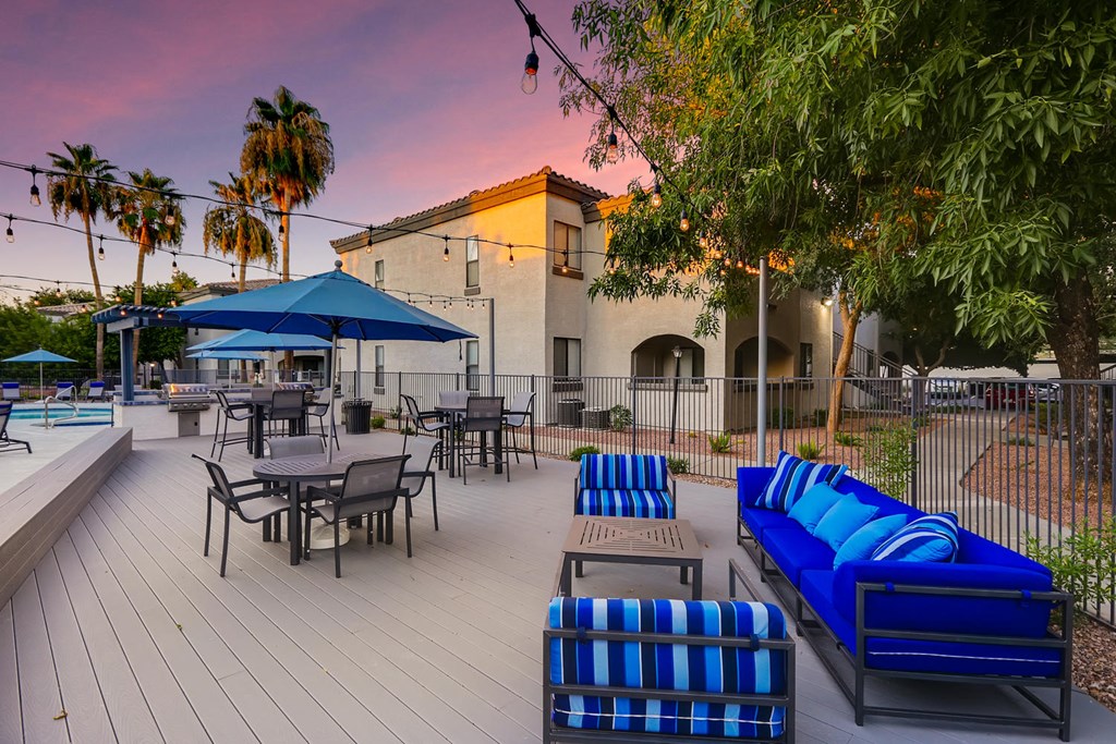our apartments have a large patio with tables and chairs