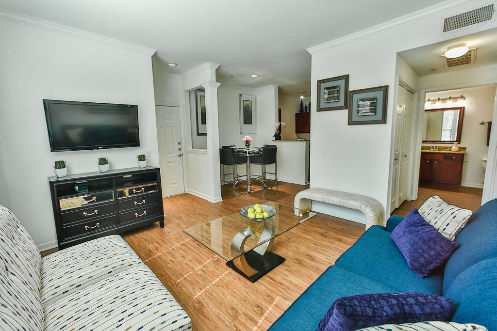 a living room with a couch and a tv