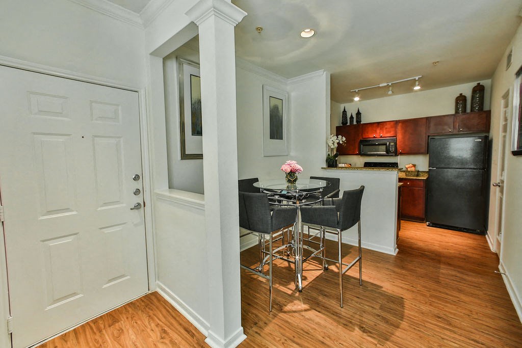 a kitchen and dining room with a table and chairs
