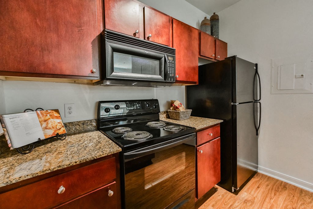 a kitchen with a stove microwave and refrigerator