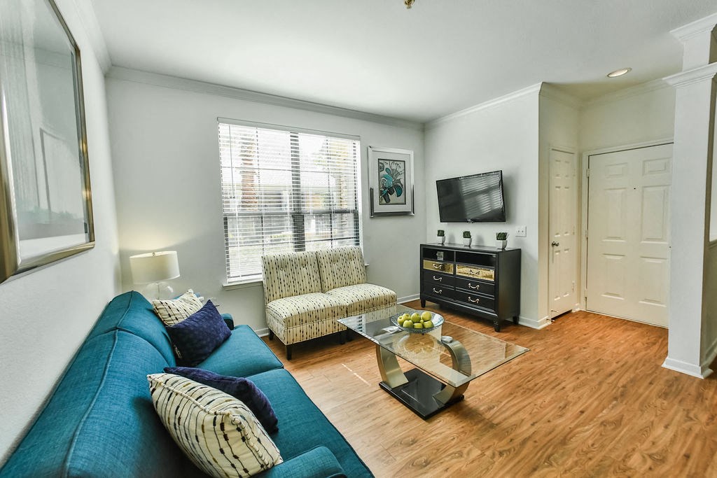 a living room with a couch and a tv