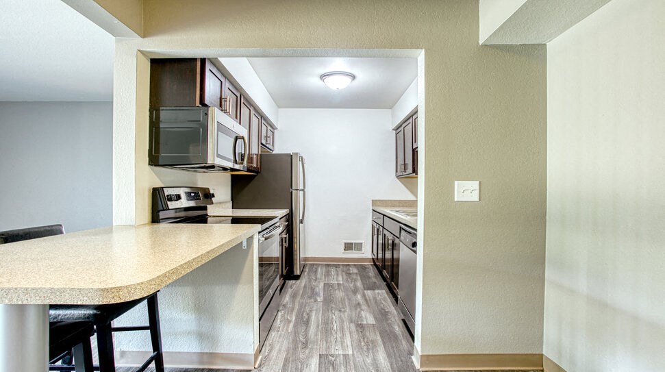 dining room brown cabinets stainless steel