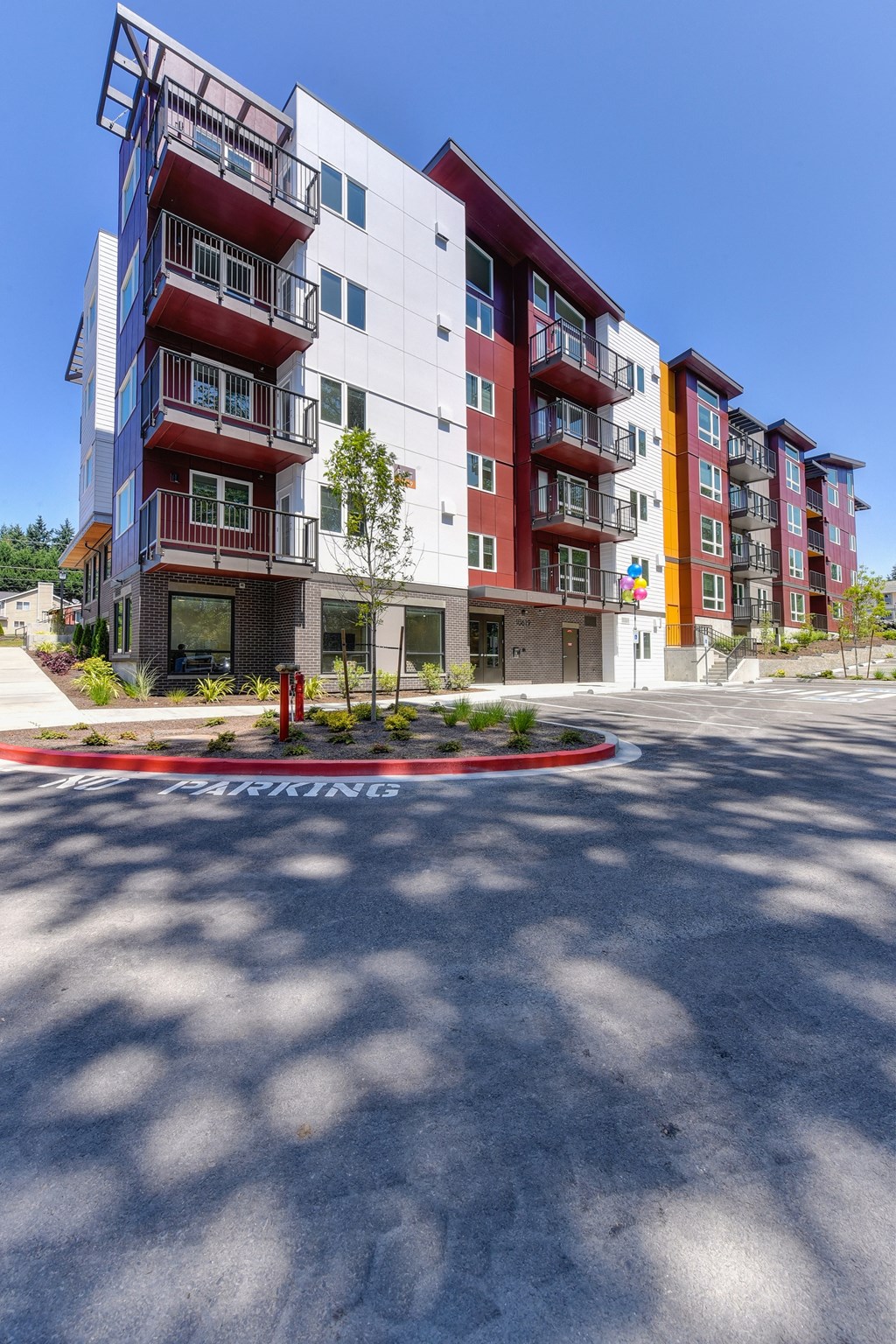 Apartment Exterior with Road, No Parking Zone, and Trees
