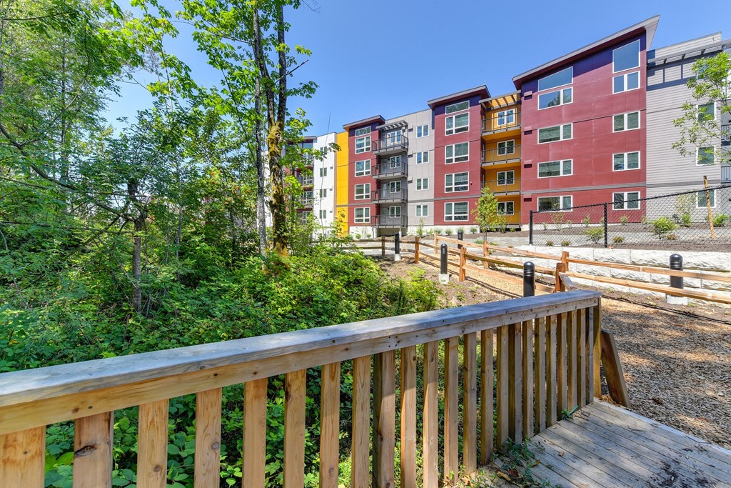 Walking Trail with Wood Chip Ground, Trees,Building Exteriors and Wooden Fence