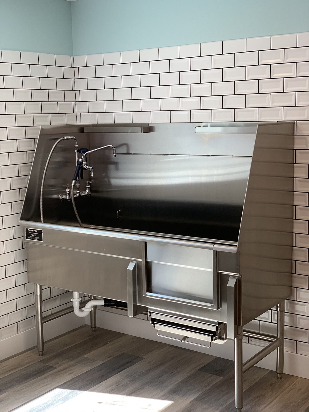 Forever Stainless Steel Animal Washer  with Sink Head and White Tile Walls