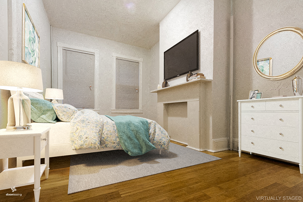 a bedroom with a bed and a tv