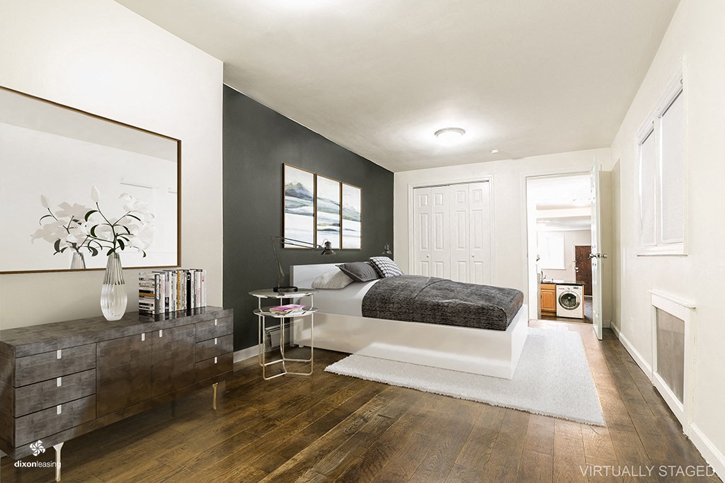 a bedroom with a bed and a dresser