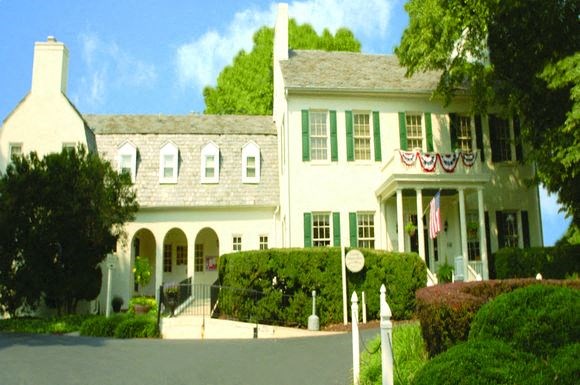 a large white house with an flag