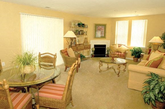 a living room filled with furniture and a table