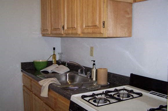 a small kitchen with a stove and a sink