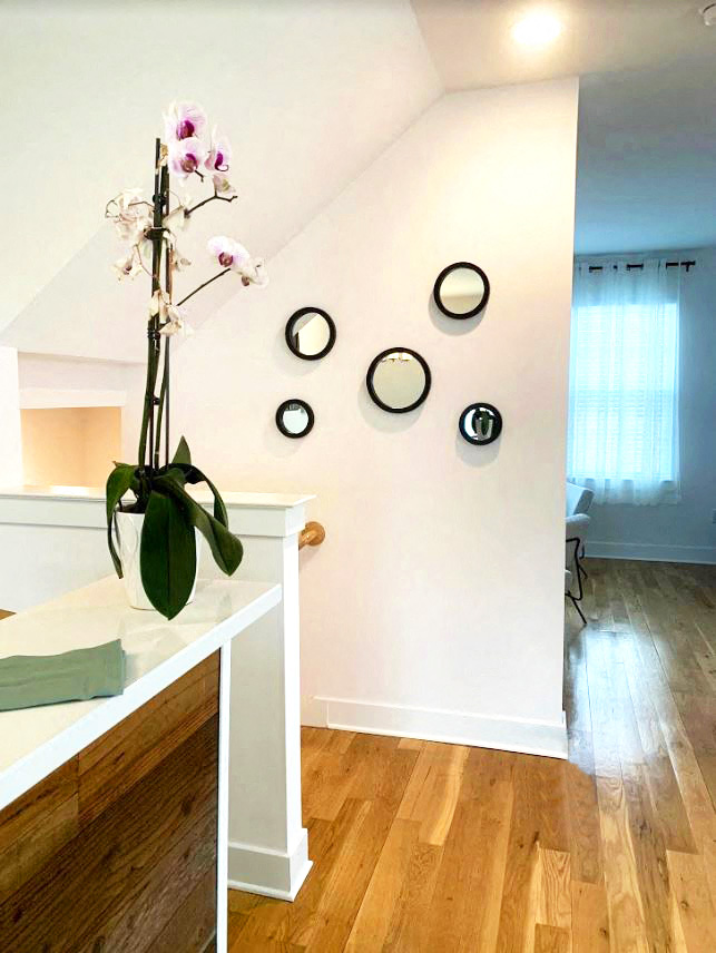 a vase with flowers on a table in a room