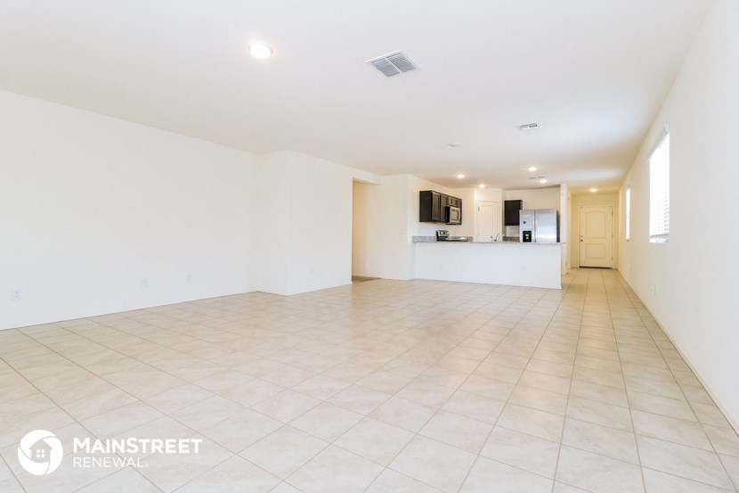 the living room and kitchen are clean and ready for guests to use
