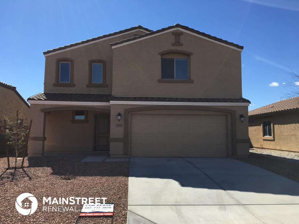 a new house with a driveway and a garage door