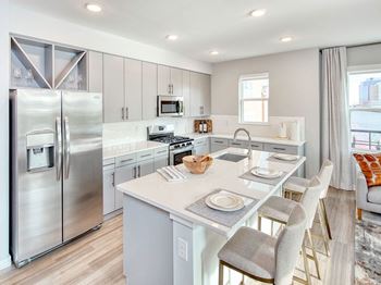White Stone Counters in Kitchen at One Harrison