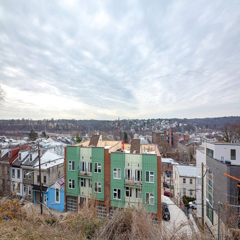 A row of houses with different colored exteriors.