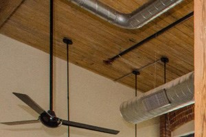 interior Apartment interior features exposed brick, classic wood beams, large windows. - Photo Gallery 2