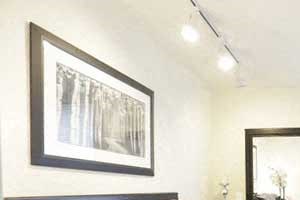Bedroom, large windows and closets, tasteful lighting.