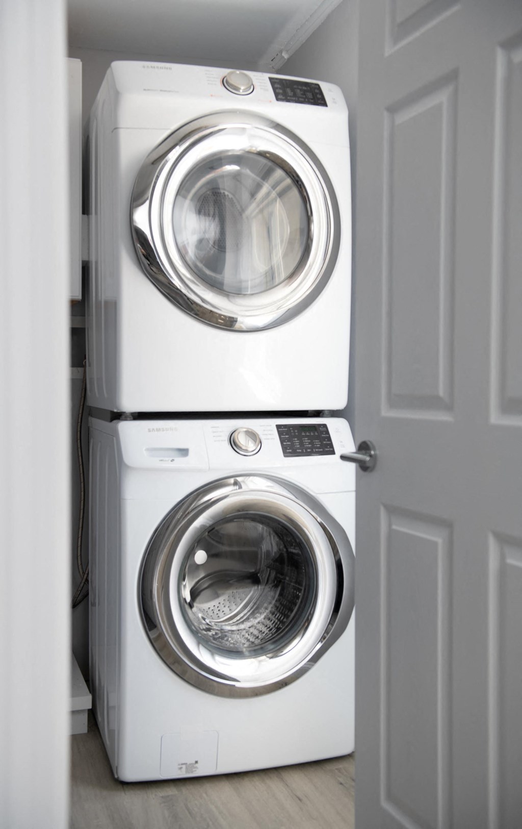 a front loading washer and dryer in a laundry room