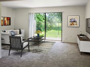 Carpeted Living Room at The Village of Hyde Park, Detroit, MI, 48207
