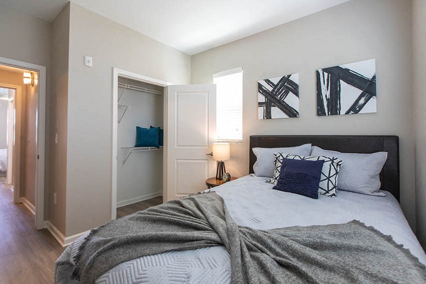 a bedroom with a bed and a closet