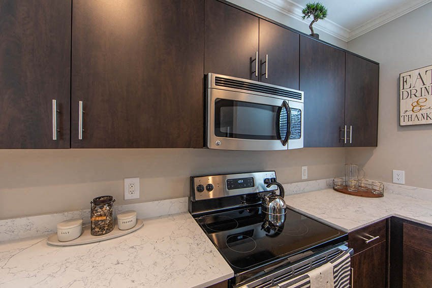 a kitchen with a stove and a microwave