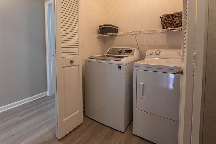 a laundry room with a washer and a dryer in it