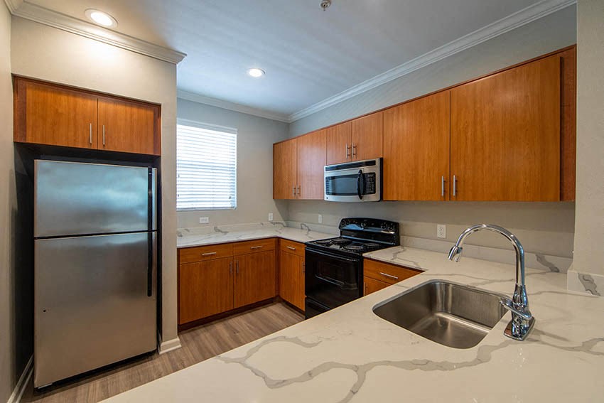 a kitchen with a sink and a refrigerator