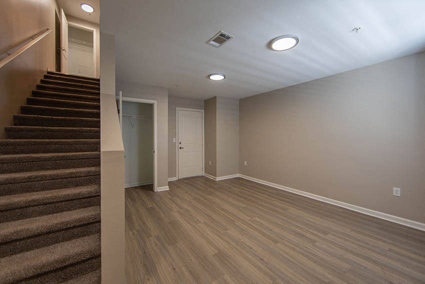 a room with a staircase and a door