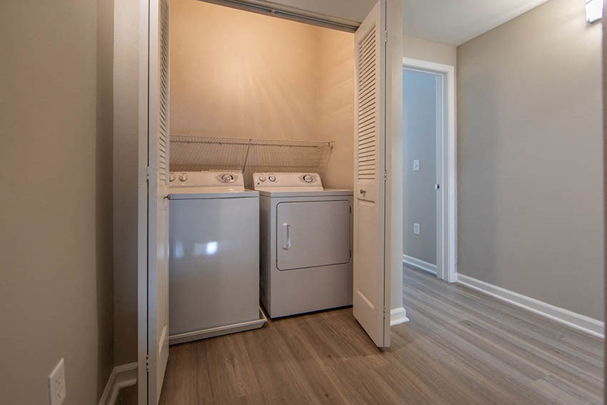 a laundry room with two washes and a dryer in it