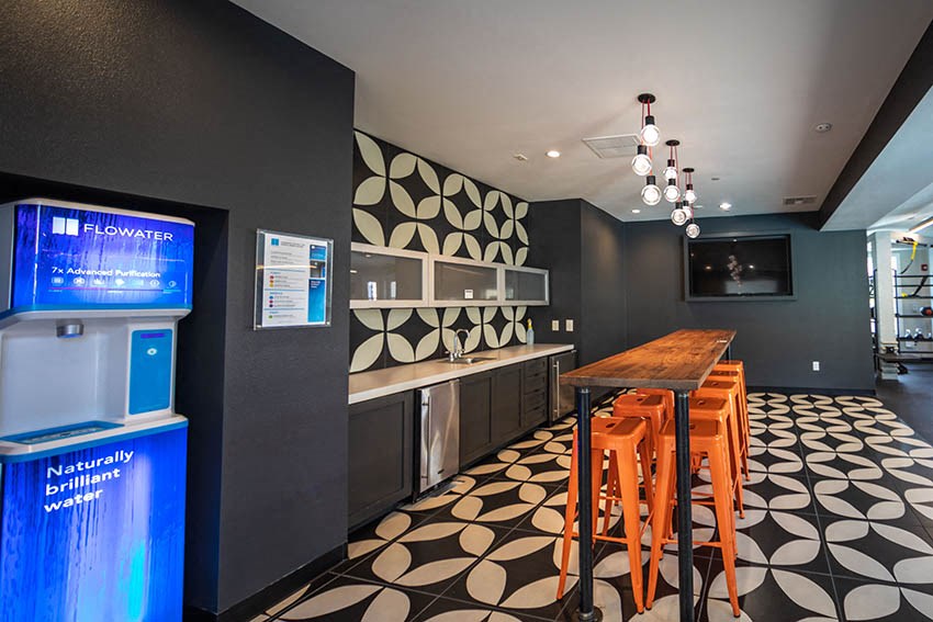 a room with a bar and a vending machine